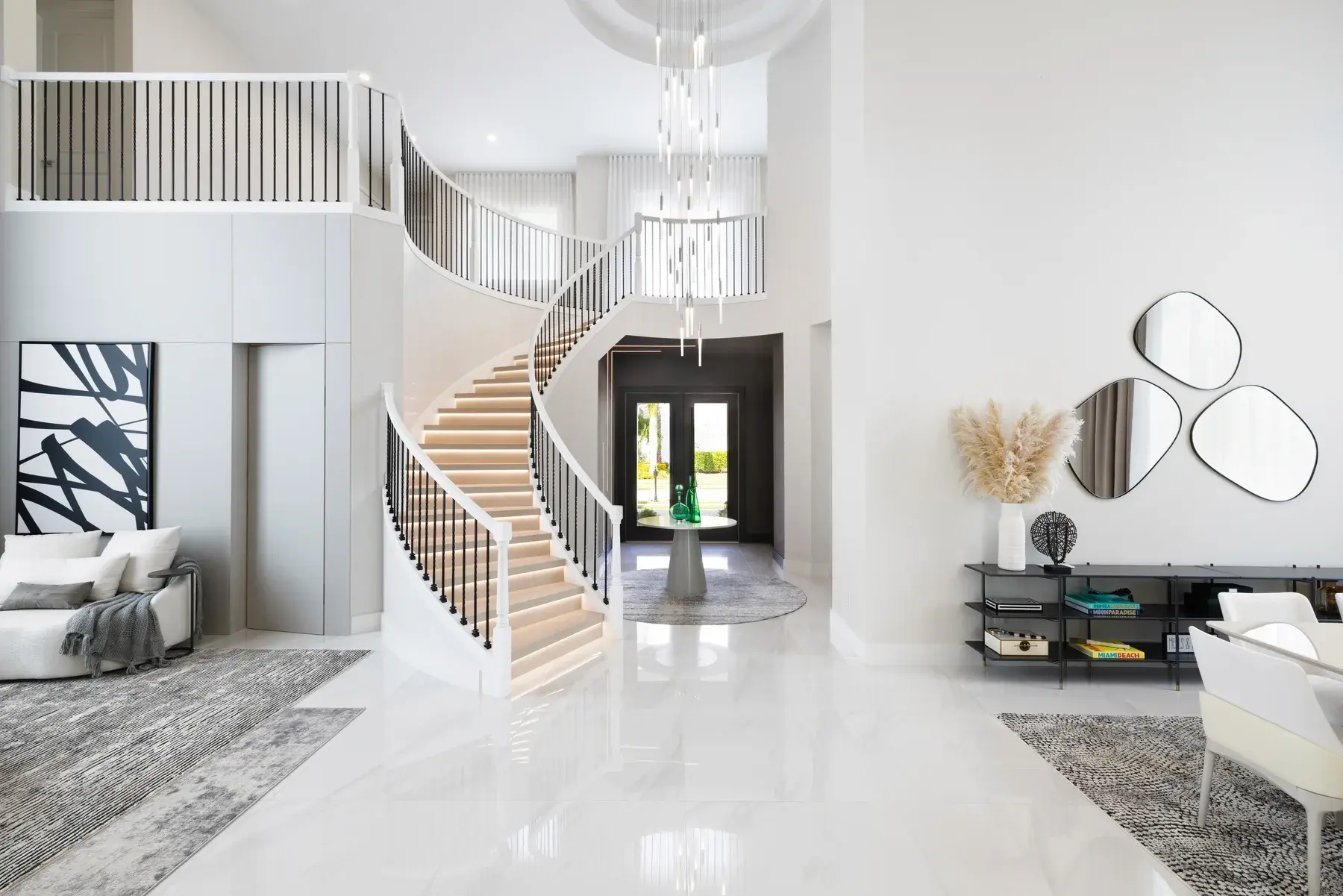 Dining room in the Coconut Grove residence with chandelier and white stone table